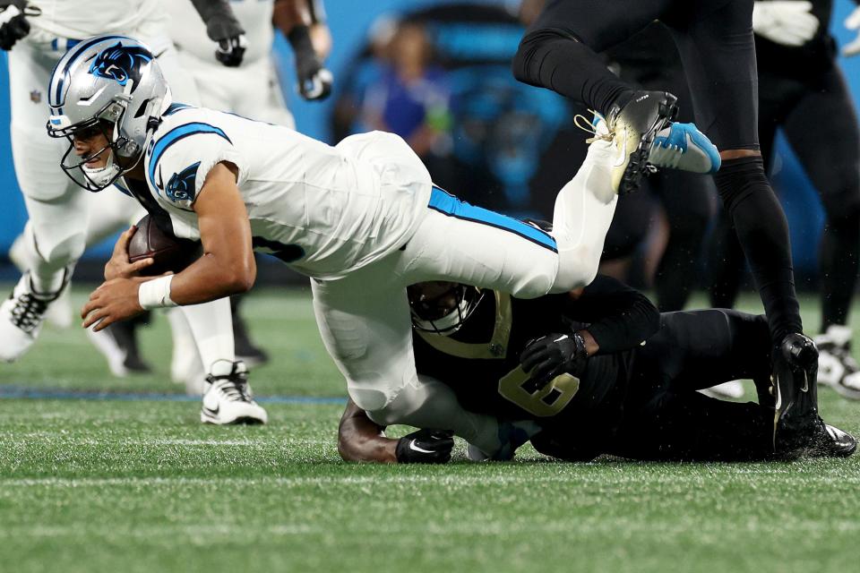 CHARLOTTE, NORTH CAROLINA - SEPTEMBER 18: Bryce Young #9 of the Carolina Panthers gets tackled by Marcus Maye #6 of the New Orleans Saints during the third quarter in the game at Bank of America Stadium on September 18, 2023 in Charlotte, North Carolina. (Photo by Jared C. Tilton/Getty Images)