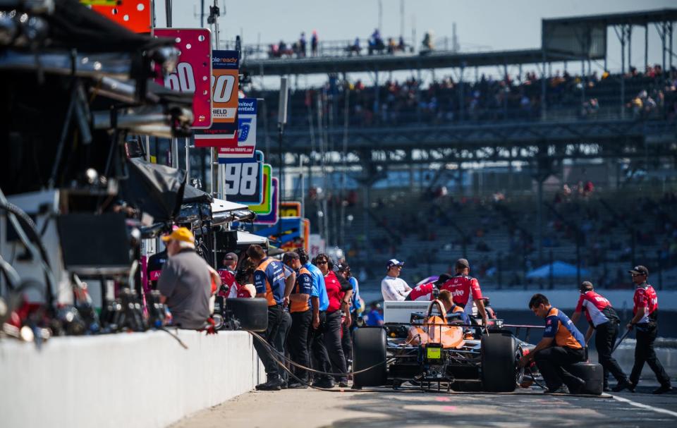 The team of Rahal Letterman Lanigan Racing driver Christian Lundgaard (30) prepare his car Friday, May 20, 2022, during Fast Friday in preparation for the 106th running of the Indianapolis 500 at Indianapolis Motor Speedway.