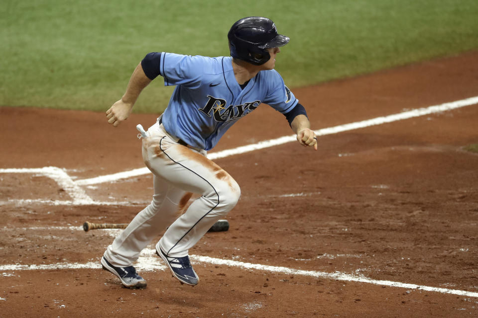 Tampa Bay Rays' Joey Wendle starts to run after hitting an RBI-single against the Philadelphia Phillies during the third inning of a baseball game Sunday, Sept. 27, 2020, in St. Petersburg, Fla. (AP Photo/Mike Carlson)