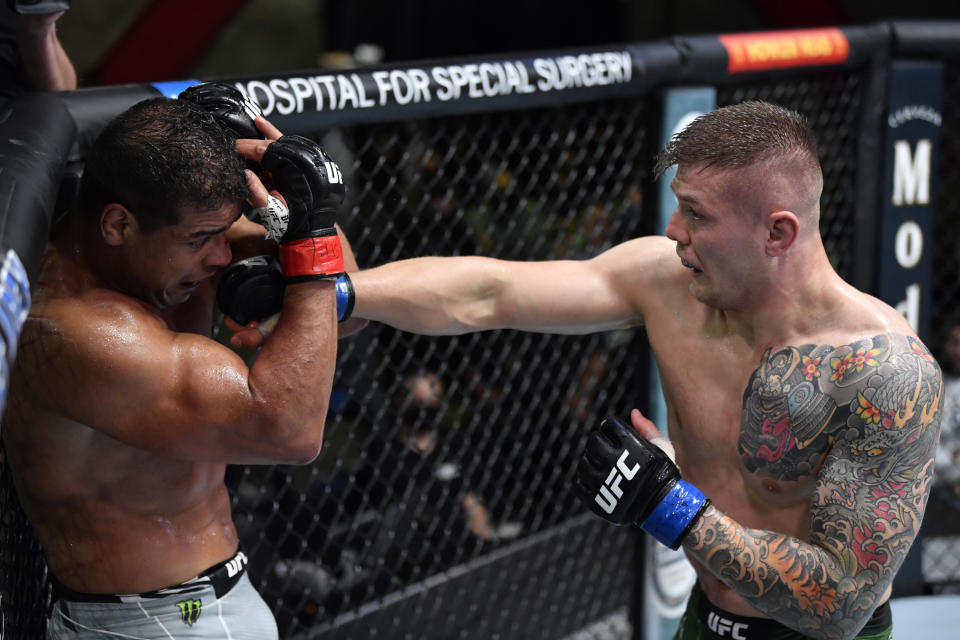 LAS VEGAS, NEVADA - OCTOBER 23: (R-L) Marvin Vettori of Italy punches Paulo Costa of Brazil in a light heavyweight fight during the UFC Fight Night event at UFC APEX on October 23, 2021 in Las Vegas, Nevada. (Photo by Jeff Bottari/Zuffa LLC)