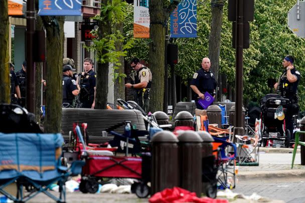 PHOTO: Law enforcement search after a mass shooting at the Highland Park Fourth of July parade in downtown Highland Park, Ill., on Monday, July 4, 2022. (Nam Y. Huh/AP)