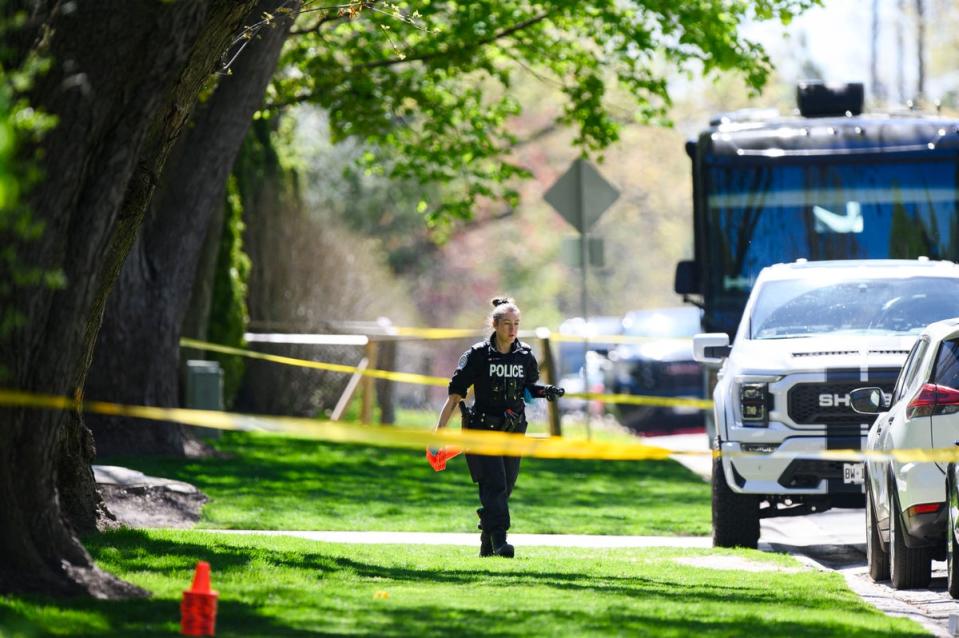 Toronto police patrol outside the home of Canadian rapper Drake after reports of a shooting early on Tuesday (AFP via Getty Images)