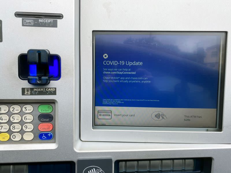 FILE PHOTO: A Chase bank drive-through ATM screen is seen with a COVID-19 message in Los Angeles