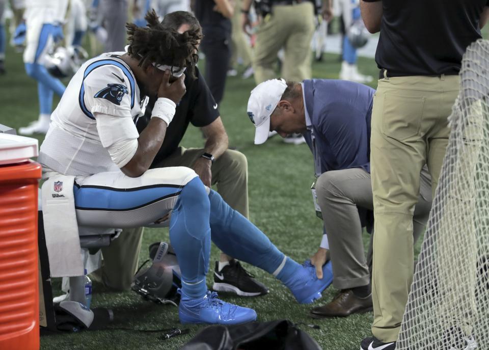 Carolina Panthers quarterback Cam Newton suffered a left foot injury on Thursday night. (AP)