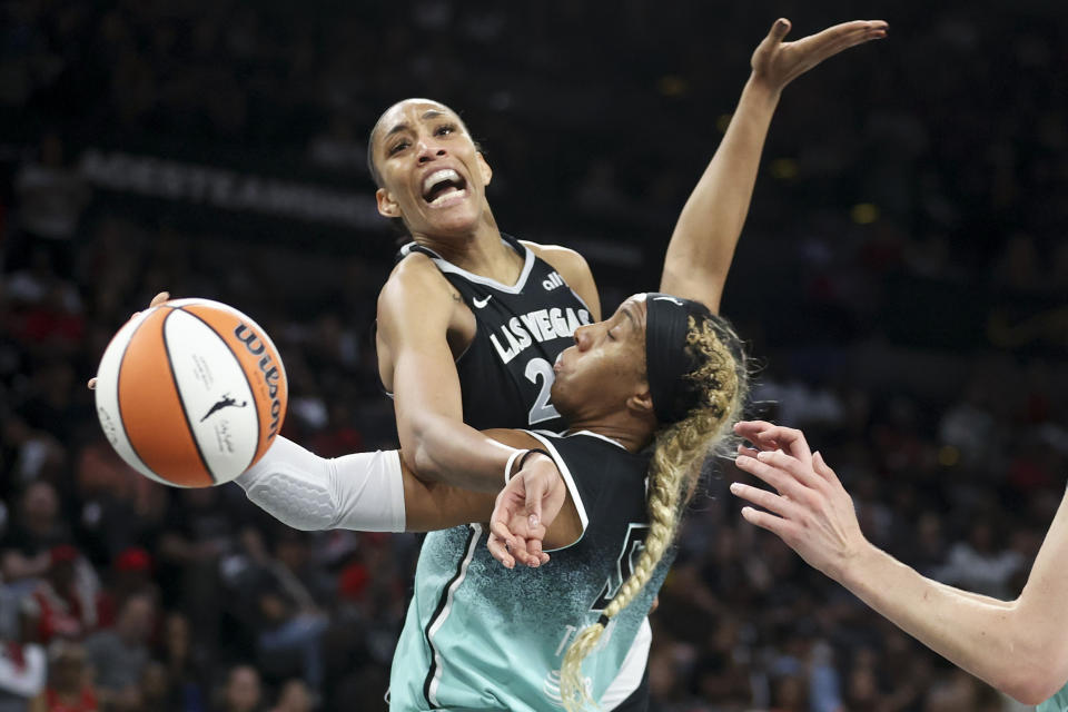 Las Vegas Aces center A'ja Wilson reacts while being fouled by New York Liberty forward Kayla Thornton during the first half of a WNBA Semifinal basketball game, Sunday, Oct. 6, 2024, in Las Vegas. (AP Photo/Ian Maule)