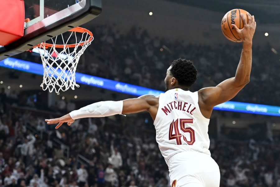 Cleveland Cavaliers’ Donovan Mitchell dunks during the first half against the Orlando Magic in Game 1 of an NBA basketball first-round playoff series, Saturday, April 20, 2024, in Cleveland. (AP Photo/Nick Cammett)