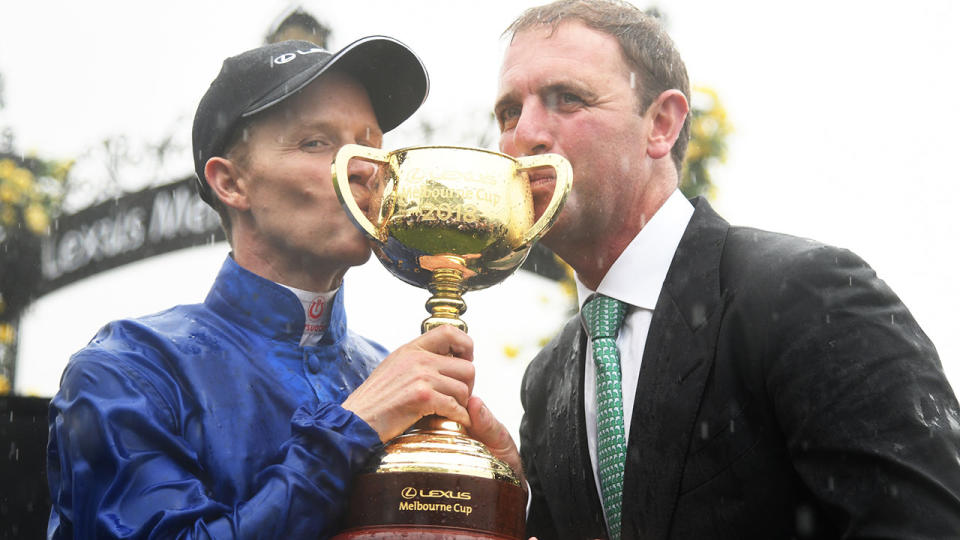 Kerrin McEvoy (L) and trainer Charlie Appleby (R) celebrate their 2018 Melbourne Cup win.