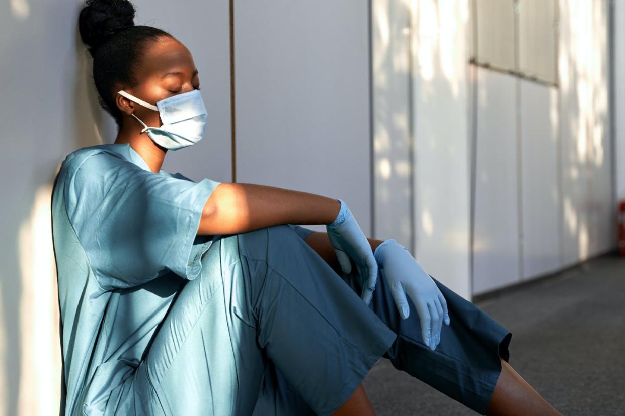   <span class="attribution"><a class="link " href="https://www.shutterstock.com/image-photo/tired-exhausted-female-african-scrub-nurse-1766425184" rel="nofollow noopener" target="_blank" data-ylk="slk:Shutterstock;elm:context_link;itc:0;sec:content-canvas">Shutterstock</a></span>