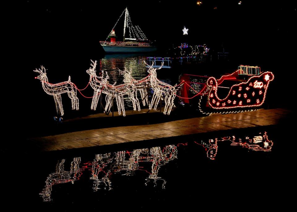 Lighted boats are ready for the Oklahoma City Holiday River Parade during a previous year's event on the Oklahoma River.