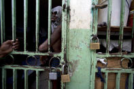 <p>An ailing prisoner stands in a cell designated for sick prisoners near the infirmary in the National Penitentiary in downtown Port-au-Prince, Haiti, Feb. 13, 2017. Prison authorities say they try their best to meet inmates’ needs, but repeatedly receive insufficient funds from the state to buy food and cooking fuel, leading to deadly cases of malnutrition-related ailments such as beriberi and anemia. (Photo: Dieu Nalio Chery/AP) </p>