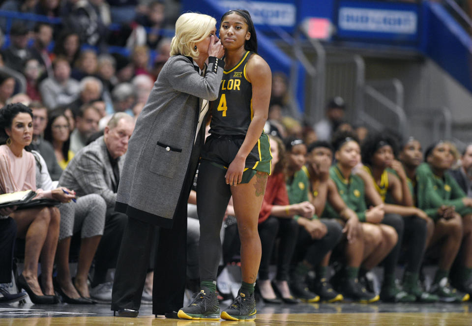 Baylor coach Kim Mulkey, left, talks with Baylor's Te'a Cooper during the second half of the team's NCAA college basketball game against Connecticut, Thursday, Jan. 9, 2020, in Hartford, Conn. (AP Photo/Jessica Hill)