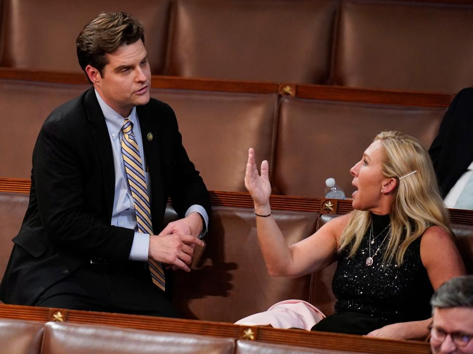 Rep. Matt Gaetz, R-Fla., left, talks with Rep. Marjorie Taylor Greene, R-Ga., during the eleventh vote in the House chamber as the House meets for the third day to elect a speaker and convene the 118th Congress in Washington, Thursday, Jan. 5, 2023.
