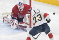 Montreal Canadiens goaltender Sam Montembeault stops Florida Panthers' Carter Verhaeghe during the first period of an NHL hockey game Thursday, March 30, 2023, in Montreal. (Graham Hughes/The Canadian Press via AP)