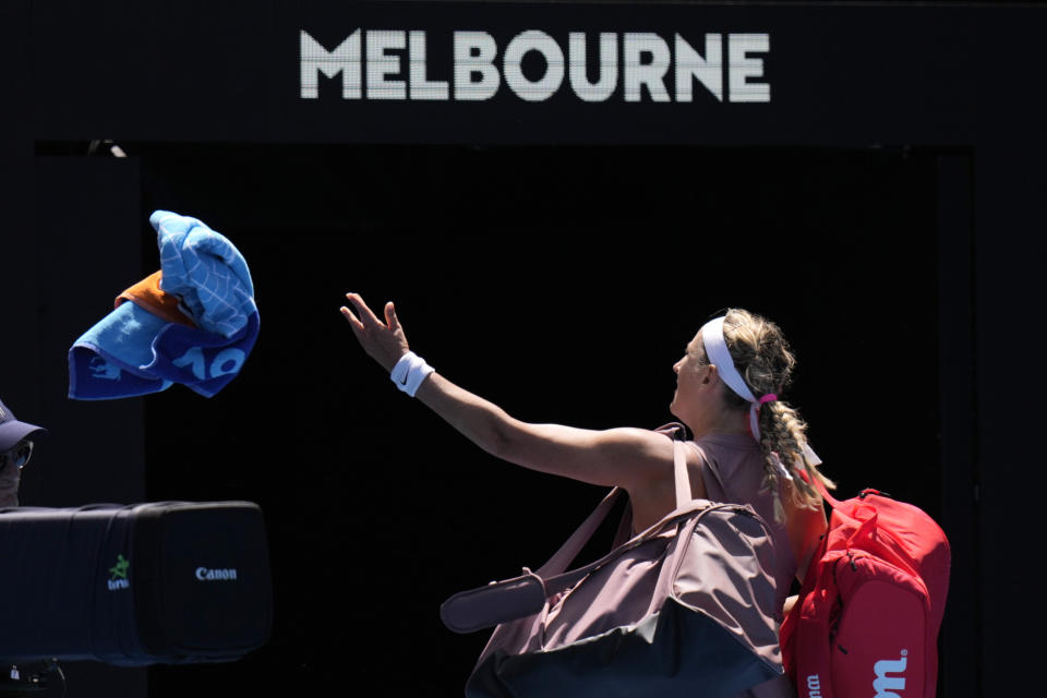 Victoria Azarenka of Belarus throws her towel into the crowd after losing her fourth round match against Dayana Yastremska of Ukraine at the Australian Open tennis championships at Melbourne Park, Melbourne, Australia, Monday, Jan. 22, 2024. (AP Photo/Andy Wong)