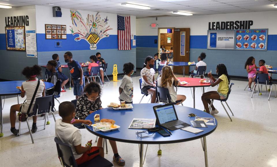 Students eat lunch Friday, June 24, 2022, at the Boys and Girls Club of Lansing. The center serves breakfast and lunch for about 80tp 100 students five days a week during the summer.