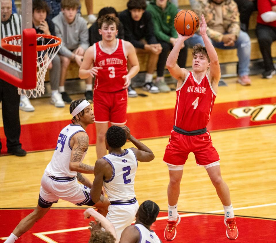 New Palestine High School junior Moses Haynes (4) shoots during the second half of an IHSAA Class 4A Boys Regional basketball game against Ben Davis High School, Saturday, March 9, 2024, at Southport High School. Ben Davis won, 70-59.