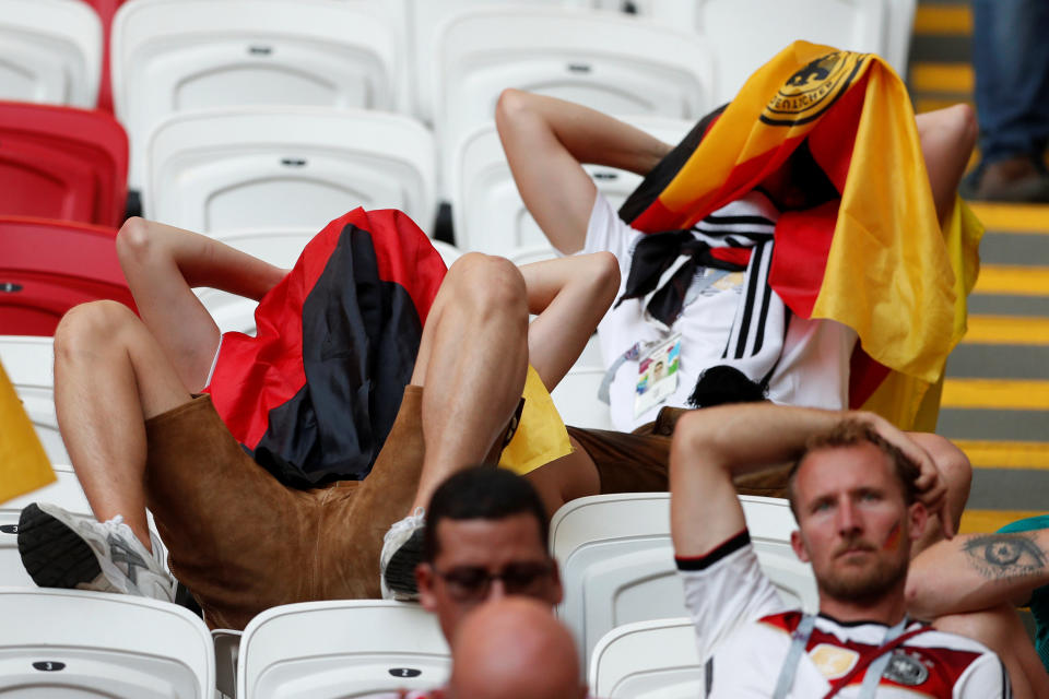 <p>Germany fans look dejected after the match as they go out of the World Cup. REUTERS/John Sibley </p>