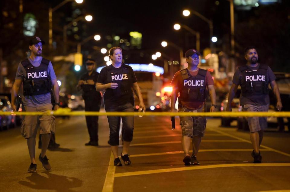 Police officers on the scene in Toronto (AP)