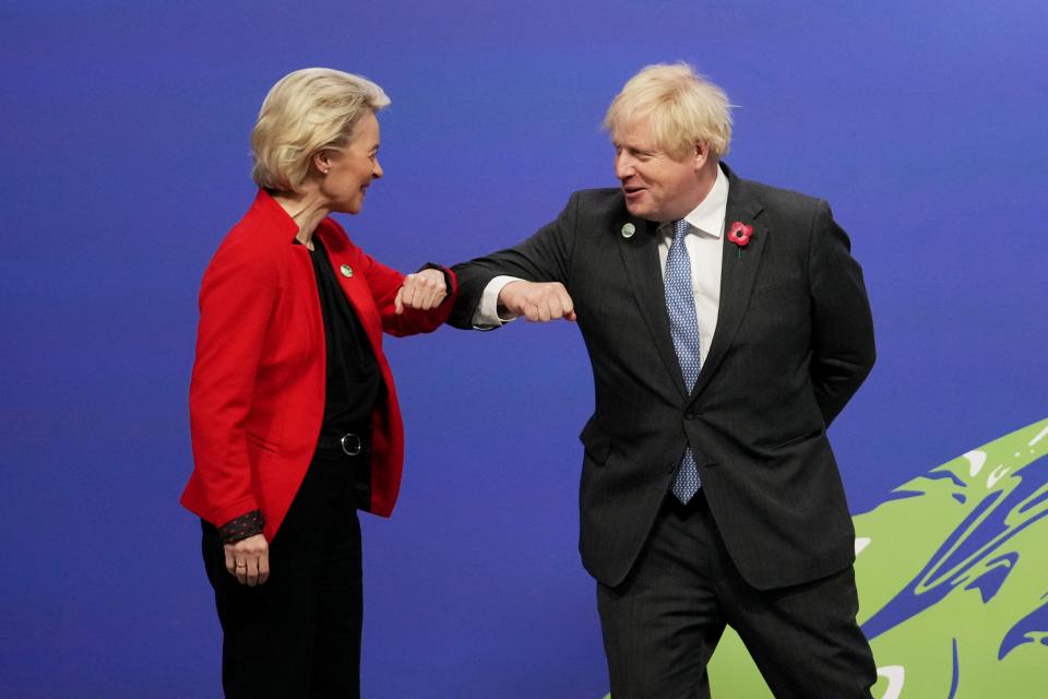 Boris Johnson greets European Commission President Ursula von der Leyen at Cop26 (AP)