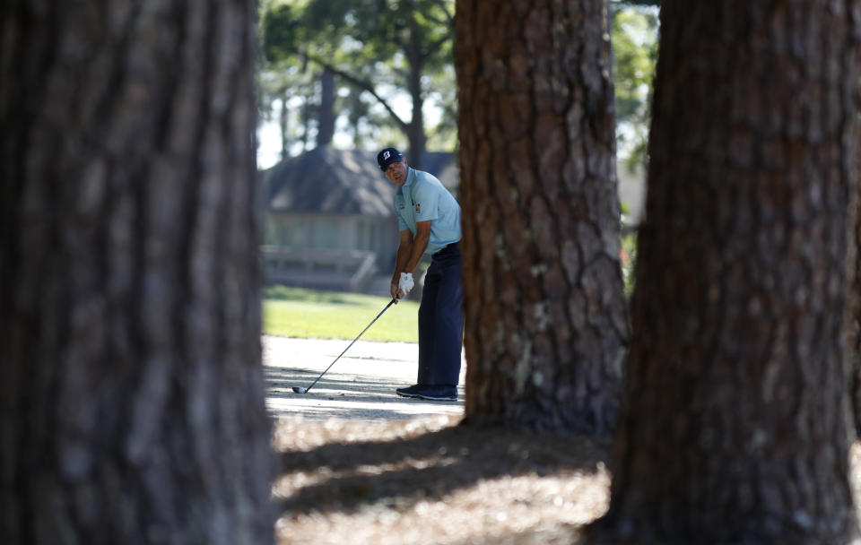 Matt Kuchar lines up his approach shot through the pine trees on 15 during the final round of the RBC Heritage golf tournament at Harbour Town Golf Links on Hilton Head Island, S.C., Sunday, April 21, 2019. Kuchar came in second place at 11- under par. (AP Photo/Mic Smith)