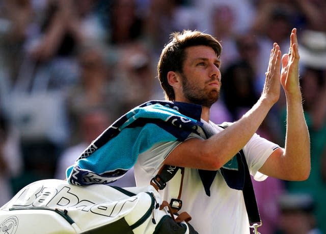 Cameron Norrie applauds after losing to Novak Djokovic