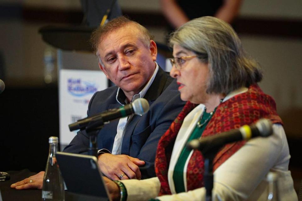 Eduardo Albor, CEO of the Dolphin Company, left, listens to Mayor Daniella Levine Cava speak during a press conference on Thursday, March 30, 2023, at the Intercontinental hotel in Downtown Miami to discuss the future of Lolita, the Miami Seaquarium orca, potentially being released into the wild.