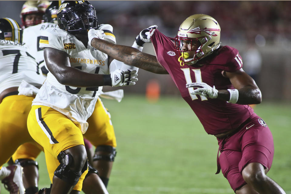 Southern Mississippi offensive lineman Kyron Barnes, front left, gets tied up with Florida State defensive lineman Patrick Payton (11) in the first quarter of an NCAA college football game Saturday, Sept. 9, 2023, in Tallahassee, Fla. (AP Photo/Phil Sears)