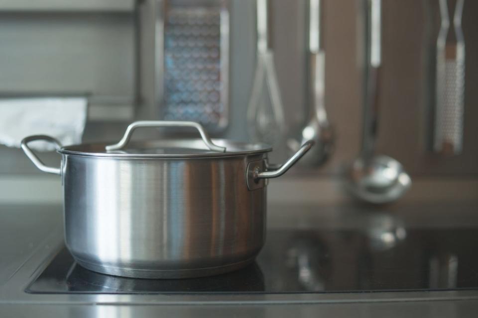 Metal cooking pan on the stove