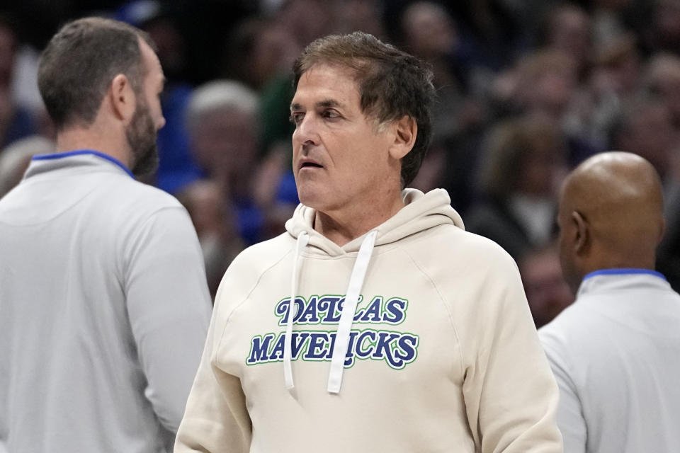 Dallas Mavericks team owner Mark Cuban walks to his seat during the first half of an NBA basketball game against the Houston Rockets in Dallas, Tuesday, Nov. 28, 2023. (AP Photo/Tony Gutierrez)