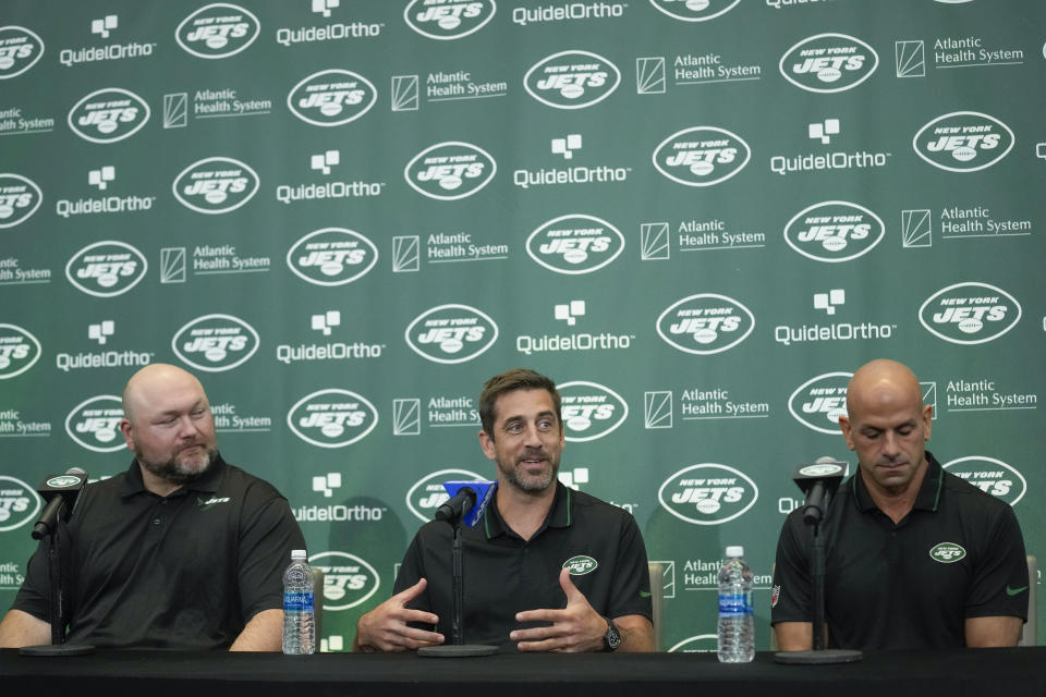 New York Jets' quarterback Aaron Rodgers, center, speaks during an NFL football press conference with general manager Joe Douglas, left, and head coach Robert Saleh at the Jets' training facility in Florham Park, N.J., Wednesday, April 26, 2023. (AP Photo/Seth Wenig)