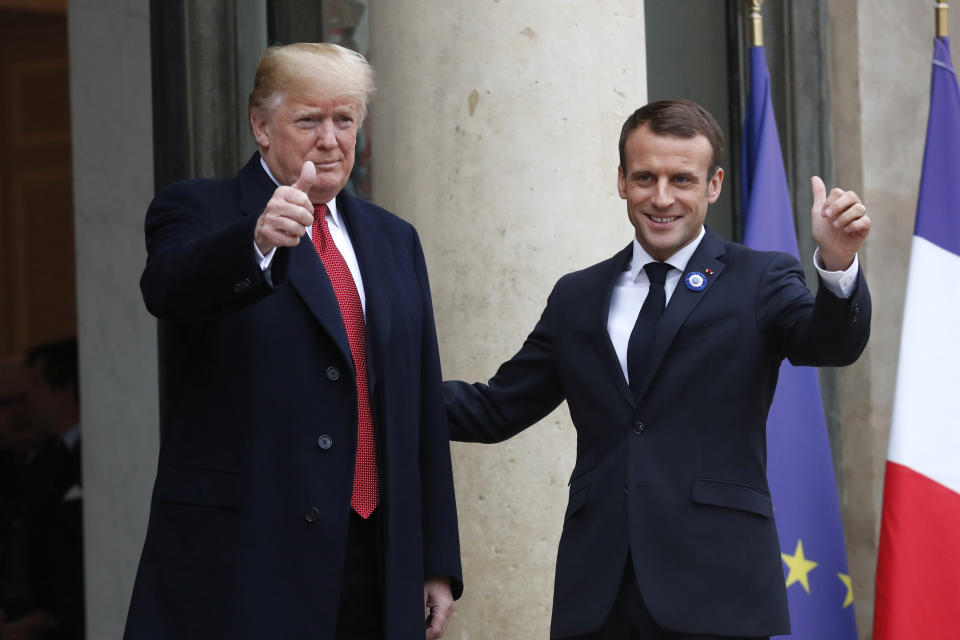 French President Emmanuel Macron, right, and U.S President Donald Trump thumb up at the Elysee Palace in Paris, Saturday, Nov.10, 2018. Trump is joining other world leaders at centennial commemorations in Paris this weekend to mark the end of World War I. (AP Photo/Thibault Camus)