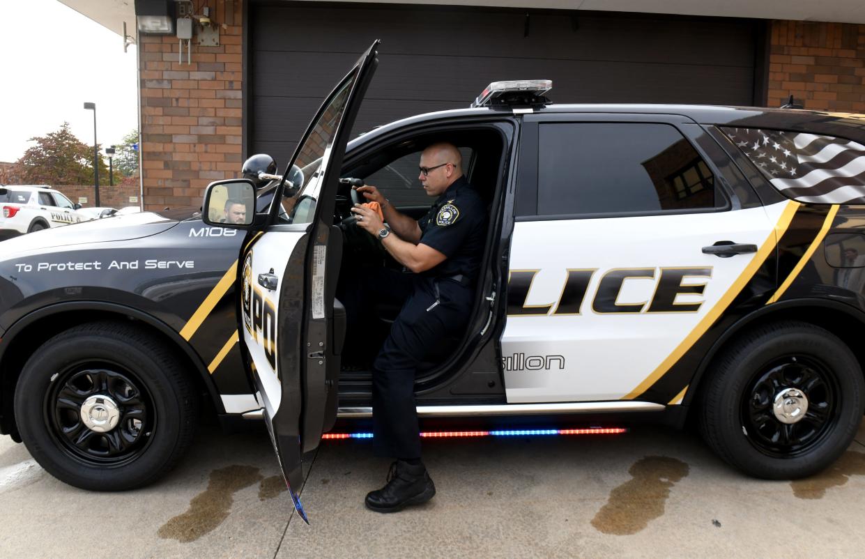 Massillon Police Chief Jason Saintenoy takes a look inside one of the Police Department's new Dodge Durango cruisers. Overall, the city purchased four new vehicles, two of which should be on the road and in service this week.