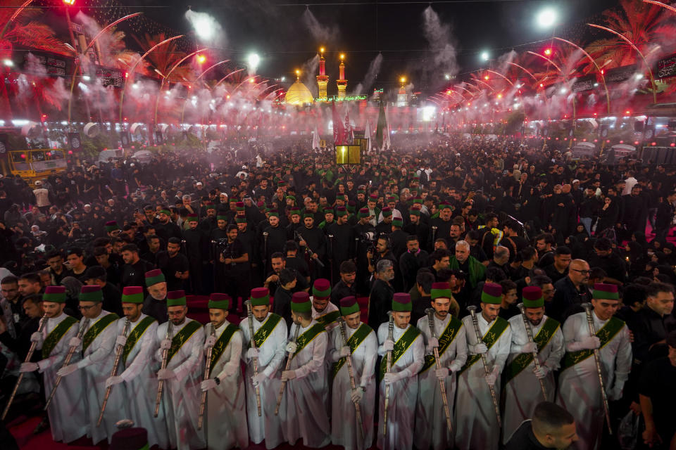 Shiites participate in the Ashoura procession on the 9th day of Muharram in Karbala, Iraq, Friday, July 28, 2023. During Muharram, Islam's second holiest month, Shiites mark the death of Hussein, the grandson of the Prophet Muhammad, at the Battle of Karbala in present-day Iraq in the 7th century. (AP Photo/Anmar Khalil)