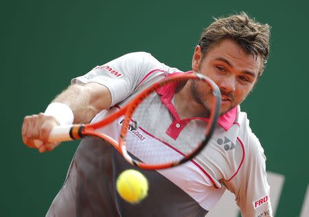 Stan Wawrinka of Switzerland returns the ball to Juan Monaco of Argentina during their match at the Monte Carlo Masters in Monaco April 15, 2015. REUTERS/Eric Gaillard