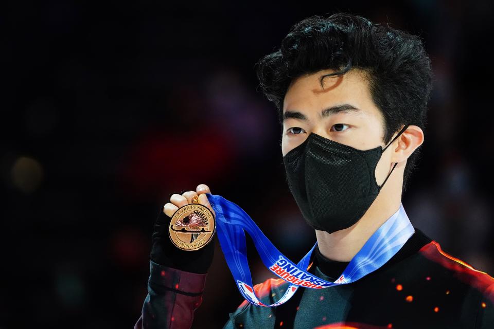 Nathan Chen celebrates after winning a gold medal during the 2022 Toyota U.S. Figure Skating Championships at Bridgestone Arena.