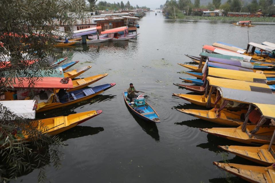 Tourists enjoy boat rides on Dal Lake on World Tourism Day in Srinagar, Kashmir (EPA)