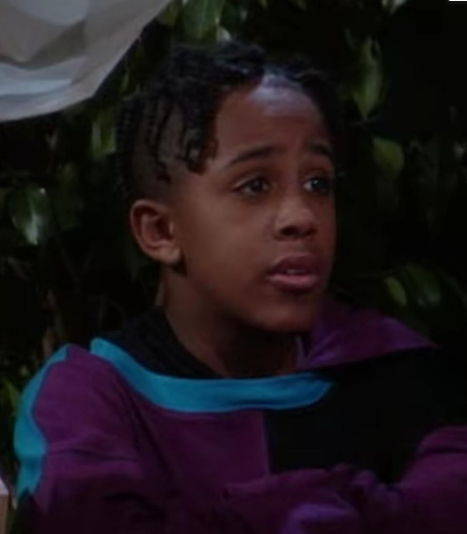 Marques Houston as Roger talks to Tia and Tamera through their window in "Sister, Sister"