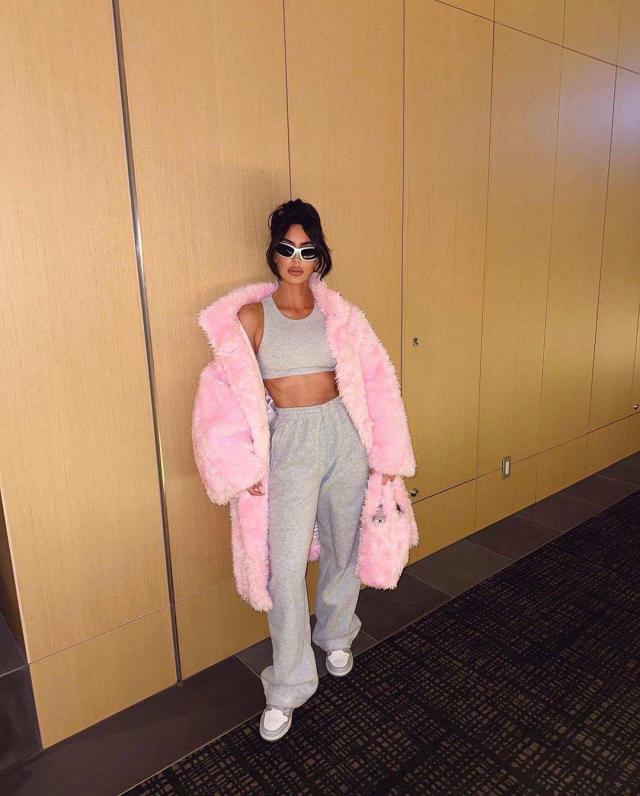 Kim Kardashian Wore a Gigantic Pink Faux Fur Coat While Playfully