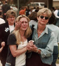 FILE - In this April 20, 1999, file photo, Fran Allison, right, comforts her daughter Brooke after they were reunited after a shooting at Columbine High School in Denver. Twelve students and one teacher were killed in a murderous rampage at the school on Tuesday, April 20, 1999, by two students who killed themselves in the aftermath. (AP Photo/Ed Andrieski, File)