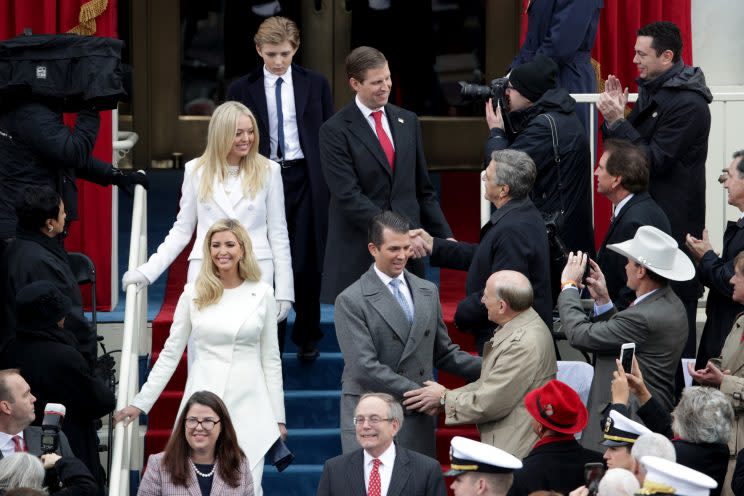 Trump's daughters opted for crisp white, while his sons dressed conservatively in dark suits and overcoats. (Photo: Getty)