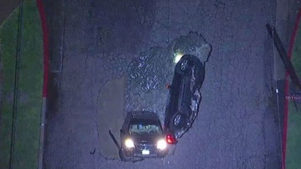 A second car was completely consumed by the six metre sinkhole. Source: Facebook / LA Fire Department