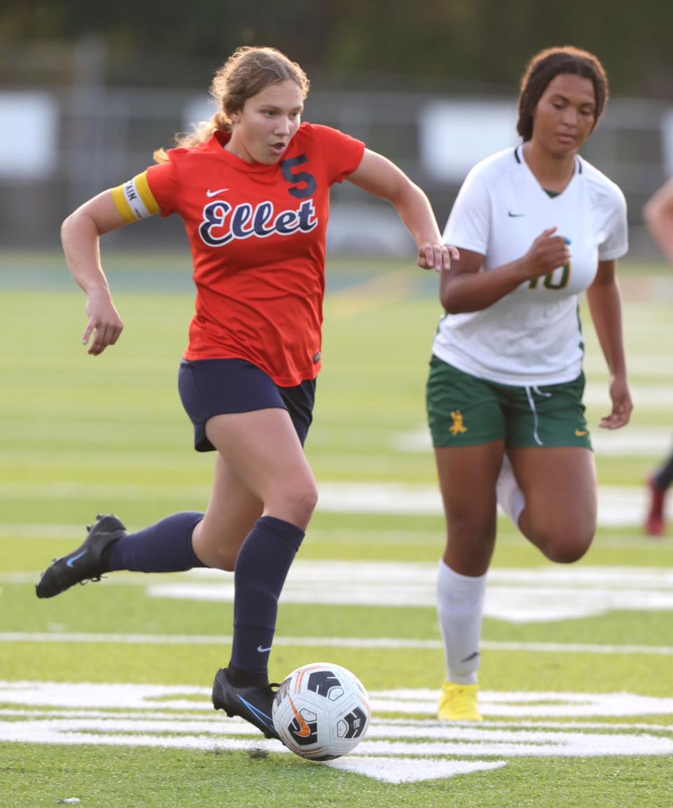 Ellet's Rachel Wenzel dribbles past Firestone's Rachelle Athey for a shot on goal during the first half on Wednesday, Sept. 21, 2022 in Akron.