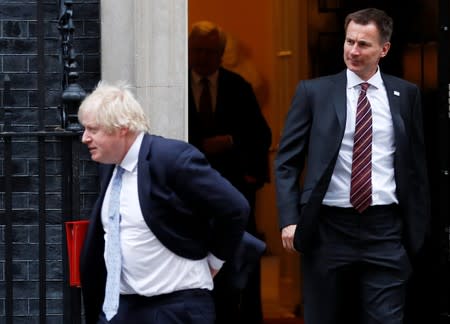 Britain's Foreign Secretary Boris Johnson and Health Secretary Jeremy Hunt leave 10 Downing Street, London