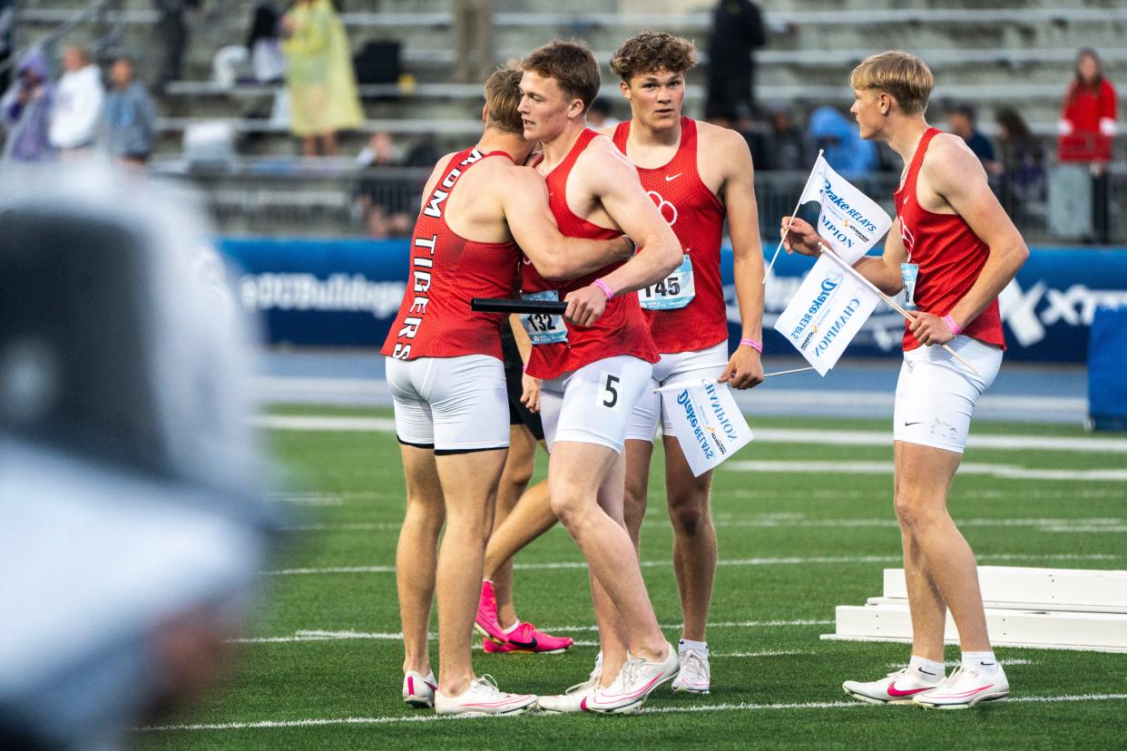 ADM celebrates after winning the 4x100 meter relay during the Drake Relays at Drake Stadium on Saturday in Des Moines.