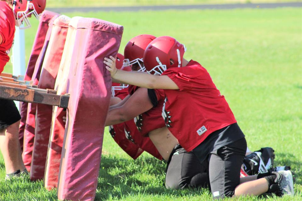 Pueblo Centennial lineman work on drills during practice at Pueblo Centennial High School as they prepare for the upcoming season.