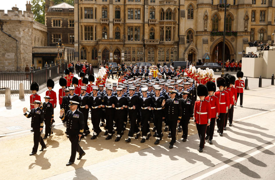 The coffin of Britain's Queen Elizabeth makes it way on the procession from Westminster Abbey following the funeral service.<span class="copyright">John Sibley—Reuters</span>