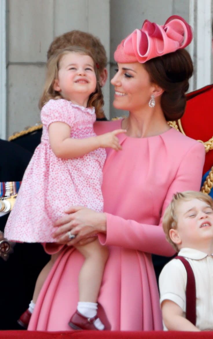 LONDON, UNITED KINGDOM - JUNE 17: (EMBARGOED FOR PUBLICATION IN UK NEWSPAPERS UNTIL 48 HOURS AFTER CREATE DATE AND TIME) Catherine, Duchess of Cambridge and Princess Charlotte of Cambridge watch the flypast from the balcony of Buckingham Palace during the annual Trooping the Colour Parade on June 17, 2017 in London, England. Trooping the Colour is a military parade to mark Queen Elizabeth II's official birthday and dates back to the time of Charles II in the 17th Century when the Colours of a Regiment were used as a rallying point in battle. (Photo by Max Mumby/Indigo/Getty Images)