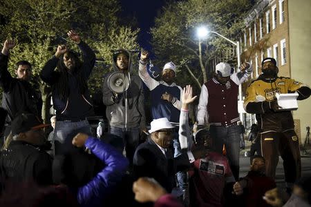 Demonstrators gather in front of the Baltimore Police Department Western District station to protest against the death in police custody of Freddie Gray in Baltimore April 23, 2015. REUTERS/Sait Serkan Gurbuz