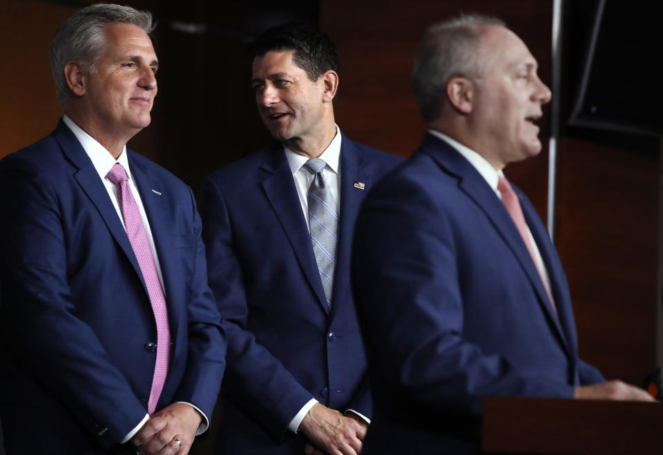 FILE - In this Sept. 13, 2018 file photo, House Speaker Paul Ryan of Wis., center, talks with House Majority Leader Kevin McCarthy of Calif., left, while House Majority Whip Steve Scalise, R-La., speaks during a news conference in Washington. As Ryan bows out of Congress, he leaves no obvious heir apparent. House Republicans are scrambling to salvage their majority but also confronting a potentially messy GOP leadership battle regardless of which party controls the chamber after the November election. (AP Photo/Jacquelyn Martin)