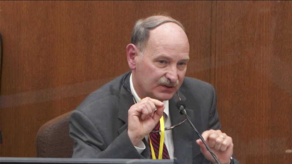 In this image taken from video, witness Dr. Bill Smock, a Louisville physician in forensic medicine, testifies as Hennepin County Judge Peter Cahill presides, Thursday, April 8, 2021, in the trial of former Minneapolis police Officer Derek Chauvin at the Hennepin County Courthouse in Minneapolis. Chauvin is charged in the May 25, 2020, death of George Floyd. (Court TV via AP, Pool)